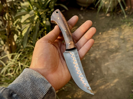 Detailed view of CuMai copper Damascus steel blade showing wave pattern and fine grind

